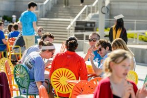 People sitting on Memorial Union Terrace chairs