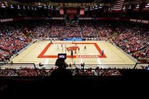 Photo of a basketball court and fans sitting in the stands