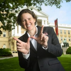 Photo of Christina Olstad making a W with her hands