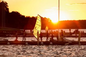 Photo of students and sail boards at the Union Terrace at sunset