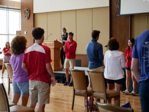 Student staff speak to guests