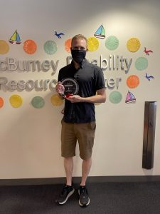 Picture of Paul holding his award