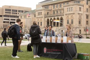 UW military kids converse with University Veterans Services staff and enjoy Babcock ice cream to celebrate the Month of the Military Kid on Library Mall on April 28, 2022.