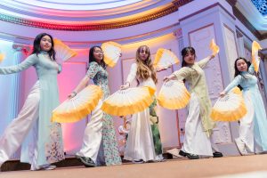 Members of the Vietnamese Student Association, also known as VSA, perform a traditional fan and straw hat or "non la" dance with a modern twist.