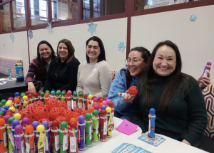  Campus AUNTIES Serena Cisneros, Laura Hiebing, Bobbi Skenandore, Susan Rudflet, and Lina Martin (left to right) at the first annual Welcome Back Bingo in Spring of 2023. Photo Credit: Noreen Siddiqui