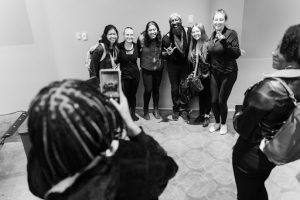 Antoine and dancers from Urban Jazz Company pose for pictures with event attendees, during ‘An Evening with Antoine Hunter: Performance, Lecture, Discussion,’ hosted by the McBurney Disability Resource Center and The Wisconsin Union Directorate (WUD) Distinguished Lecture Series (DSL) Committee, on October 7, 2024, in Shannon Hall, Memorial Union. Antoine and dancers began with a choreographed performance, followed by both a lecture and a Q&A opportunity. (Photo by Robert San Juan/ UW-Madison) 