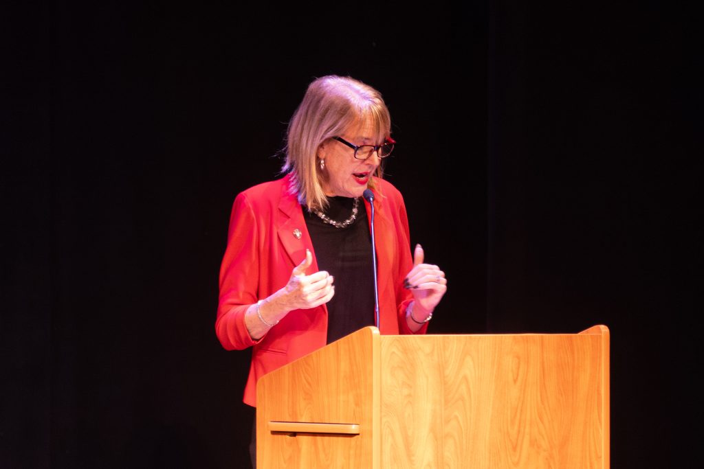 Dr. Reesor speaks at a podium. 