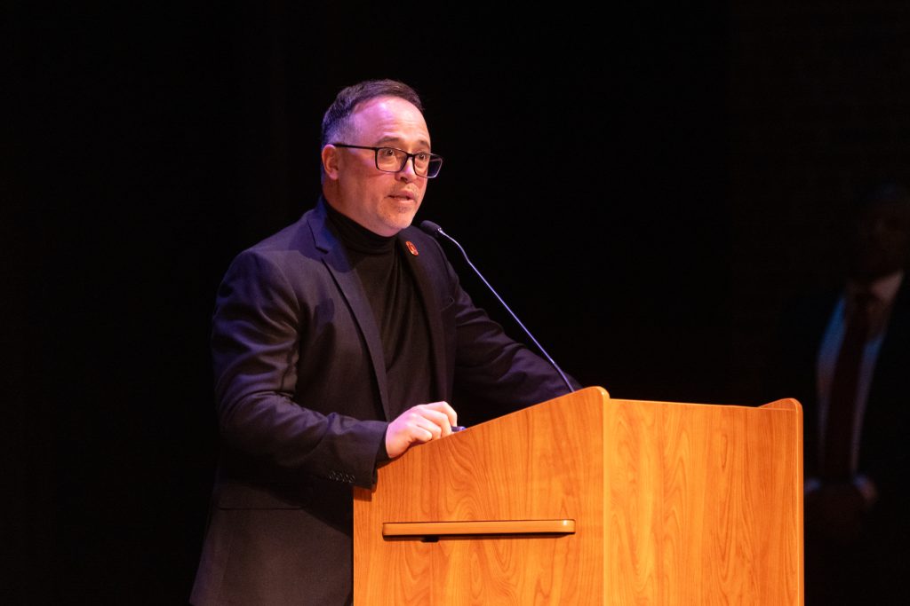 Dr. Raul Leon speaks at a podium