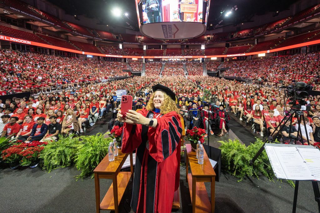 UW Chancellor Jennifer L. Mnookin takes a selfie with the incoming class during the Chancellor's Convocation for New Students, a Wisconsin Welcome event held at the Kohl Center.