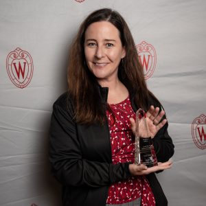 Kate Schwartz poses with their award.