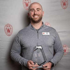Chris Berger poses with their award.