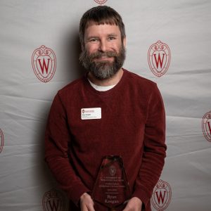 Ryan Keegan poses with their award.