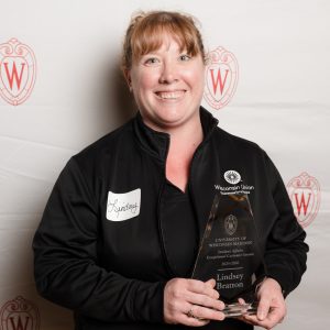 Lindsey Bratton poses with their award.
