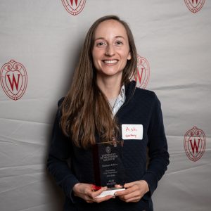 Ash Engel posing with their award.