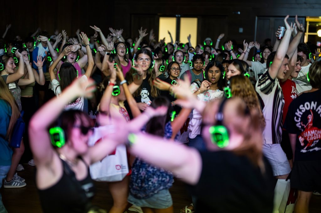 People participating in a silent disco at Union South during the Sunburst Festival.