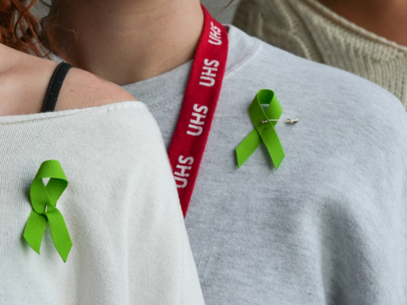 Image of UHS staff with green prevention ribbons on their shirts